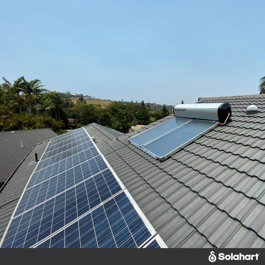 A Roof With Solar Panels And A Water Heater On It — David Lewis Solahart in Goonellabah, NSW