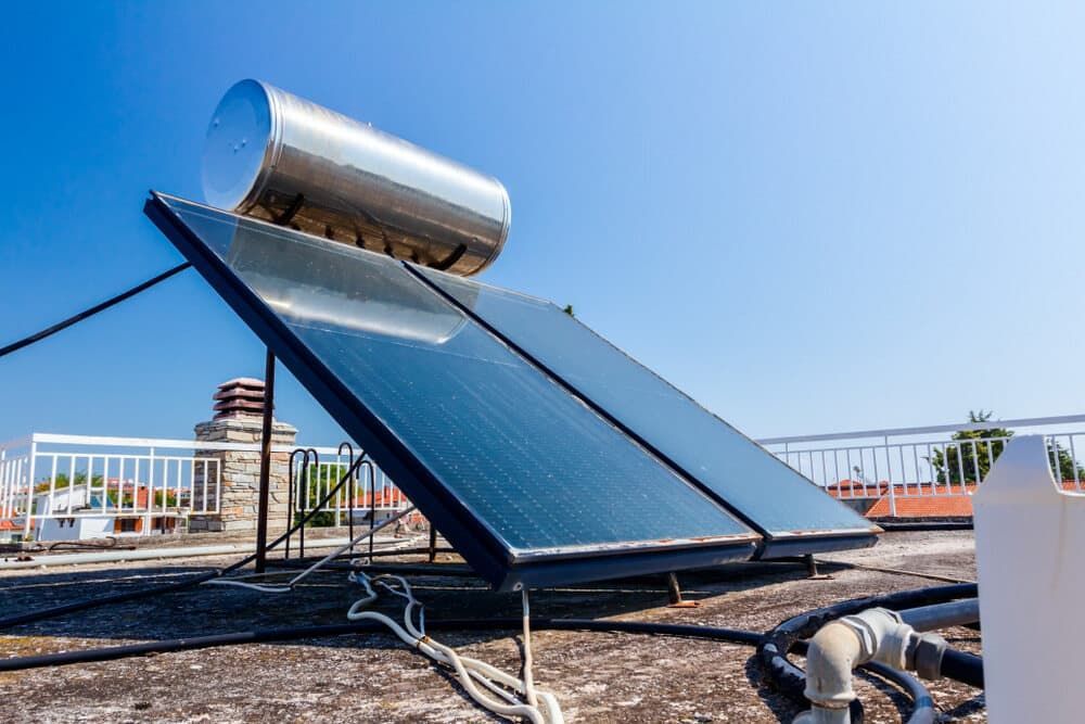 A Solar Water Heater Is Sitting On Top Of A Roof — David Lewis Solahart in Kingscliff, NSW