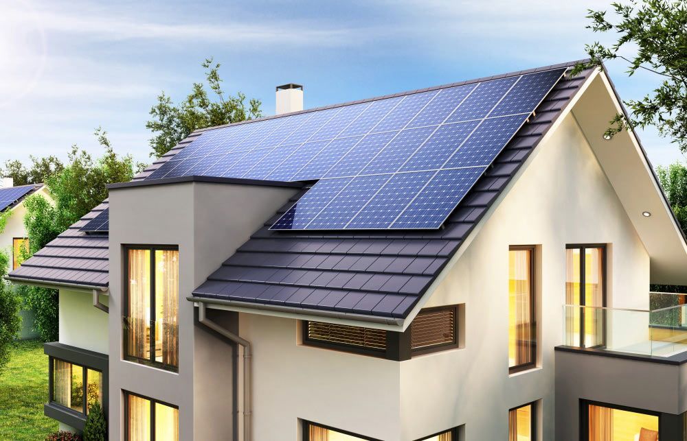A House With A Lot Of Windows And Solar Panels On The Roof — Solahart In Goonellabah, NSW