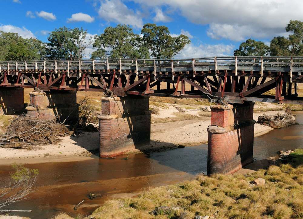 A Bridge Over A River With Trees In The Background — David Lewis Solahart in Tenterfield, NSW