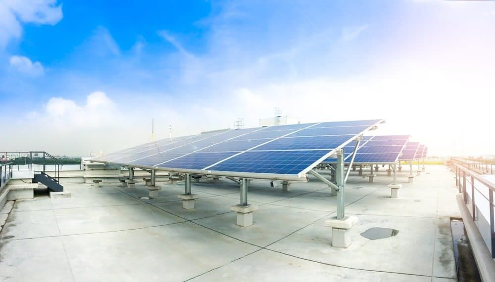 A Row Of Solar Panels On A Roof With A Blue Sky In The Background — David Lewis Solahart in Bangalow, NSW