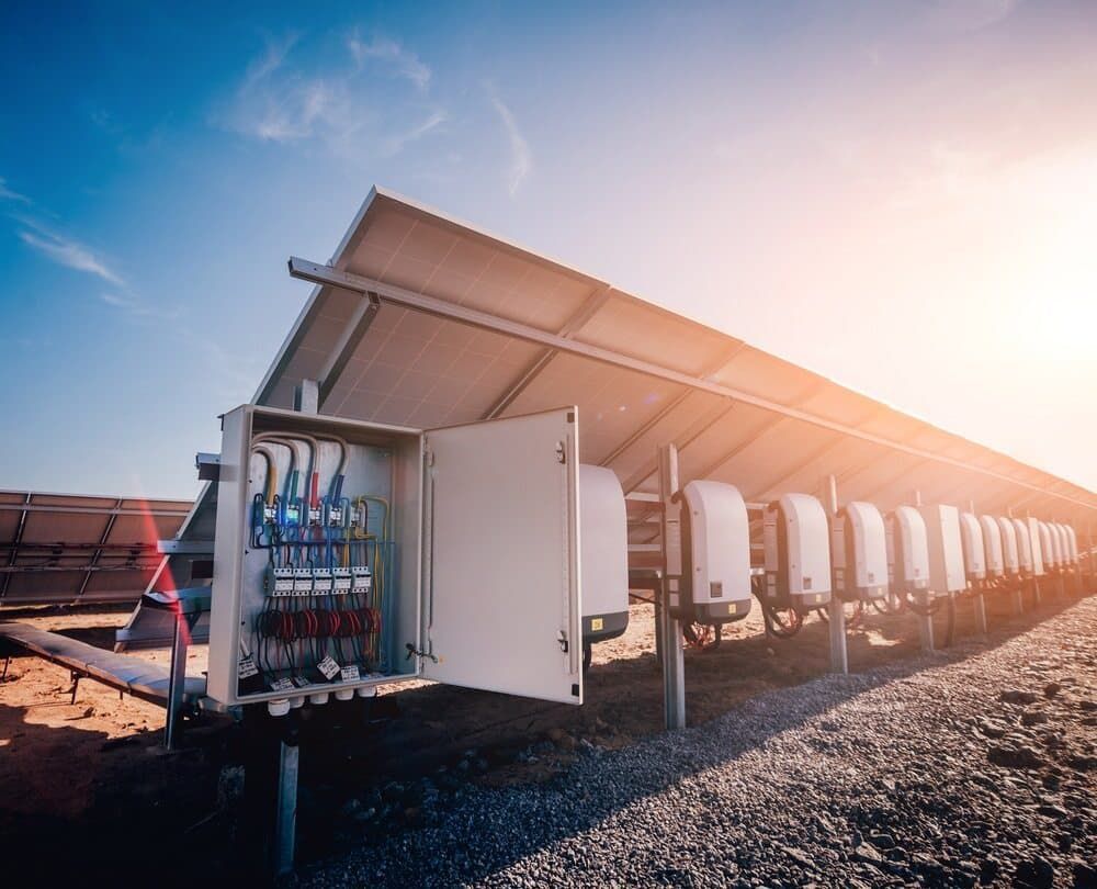 A Row Of Solar Panels Sitting Next To Each Other On Top Of A Dirt Field — David Lewis Solahart in Goonellabah, NSW