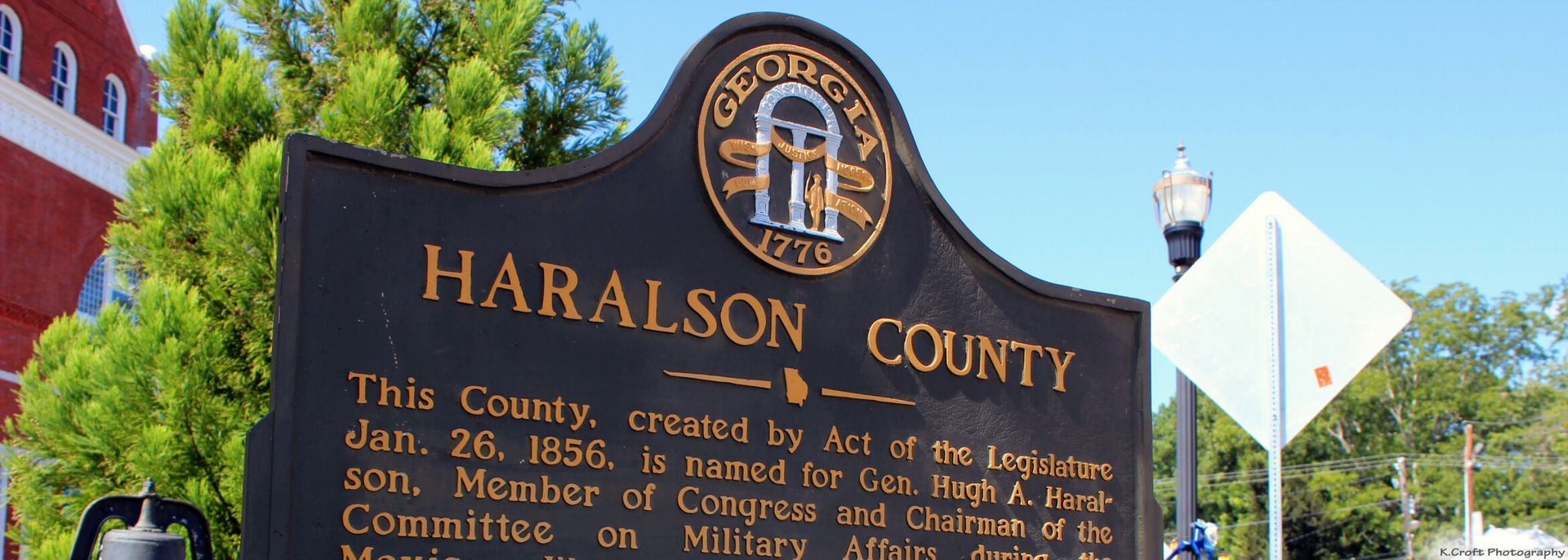 The sun is setting over the ocean and the waves are crashing on the beach.