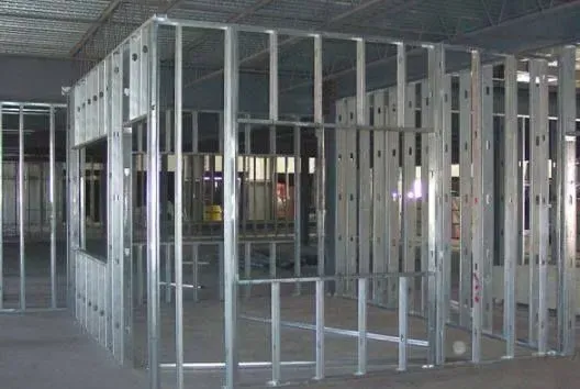 A room with a lot of metal frames on the wall.