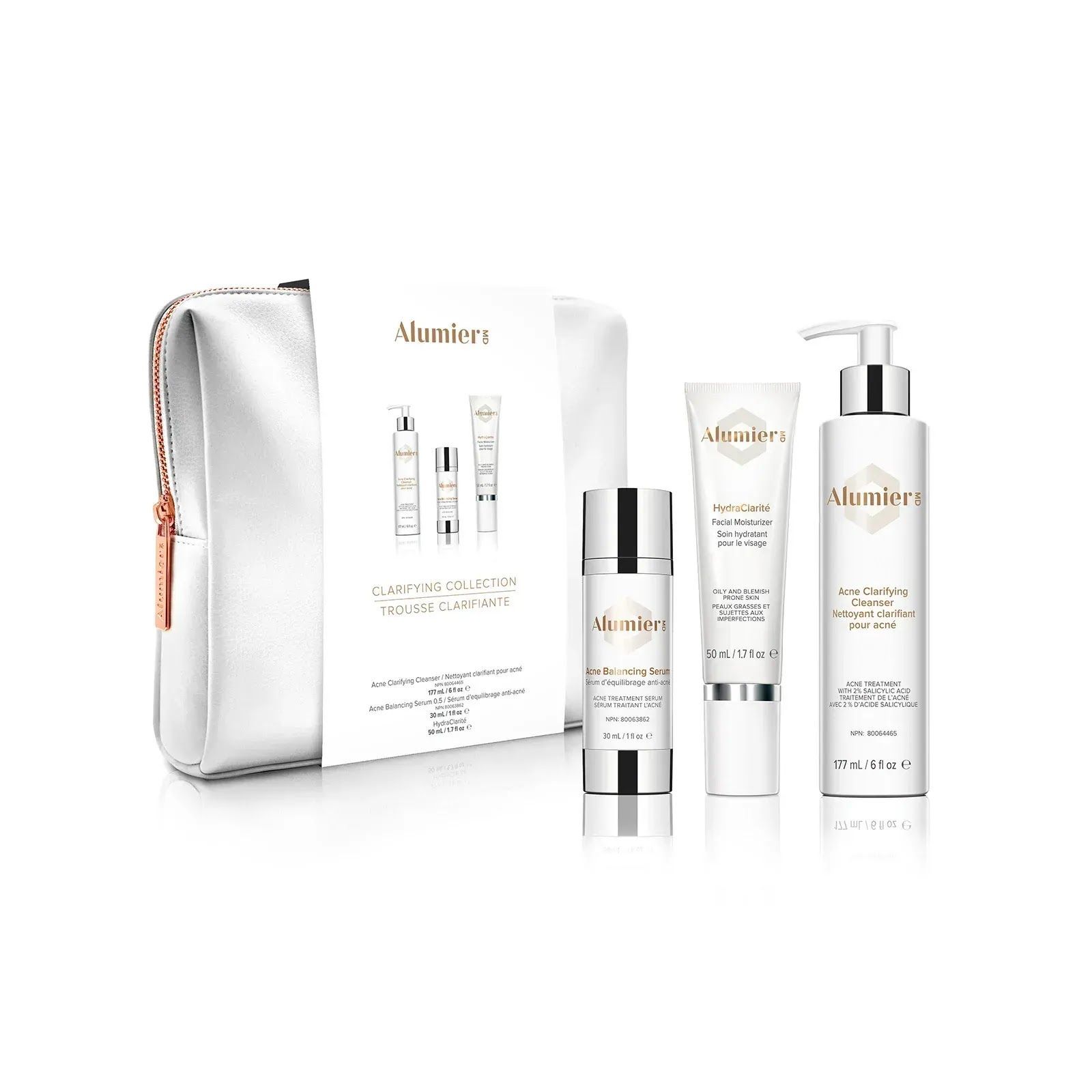 An AlumierMD skincare set, including three bottles and a silver travel bag, arranged on a white background.