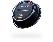 Round black car air-conditioning control knob labeled “Max A/C” and “A/C” with orange accents