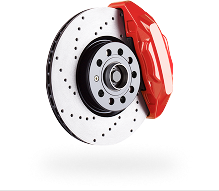 Red brake caliper on a ventilated car disc brake rotor.