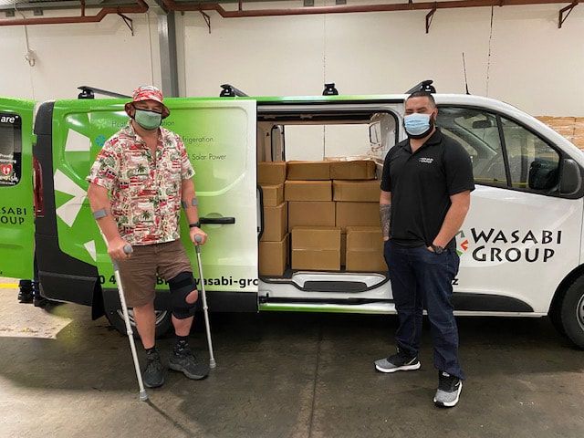 Men Wearing Masks Standing in Front of a Wasabi Group Van — Wellington, NZ — Wasabi Group Limited