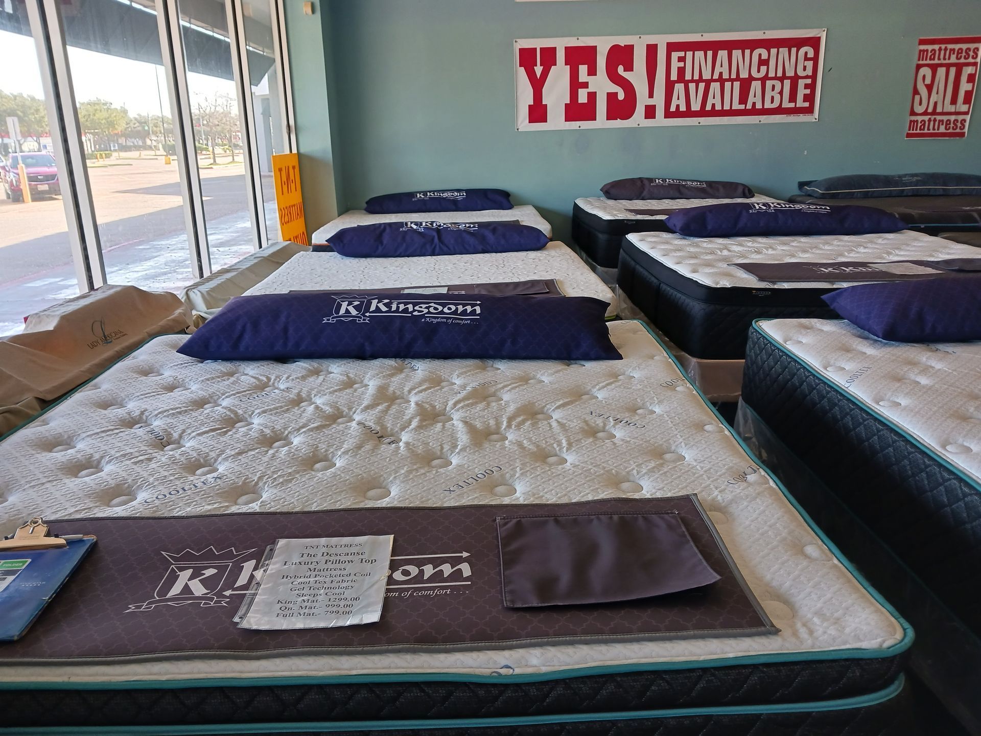 A mattress store with a sign that says yes financing available
