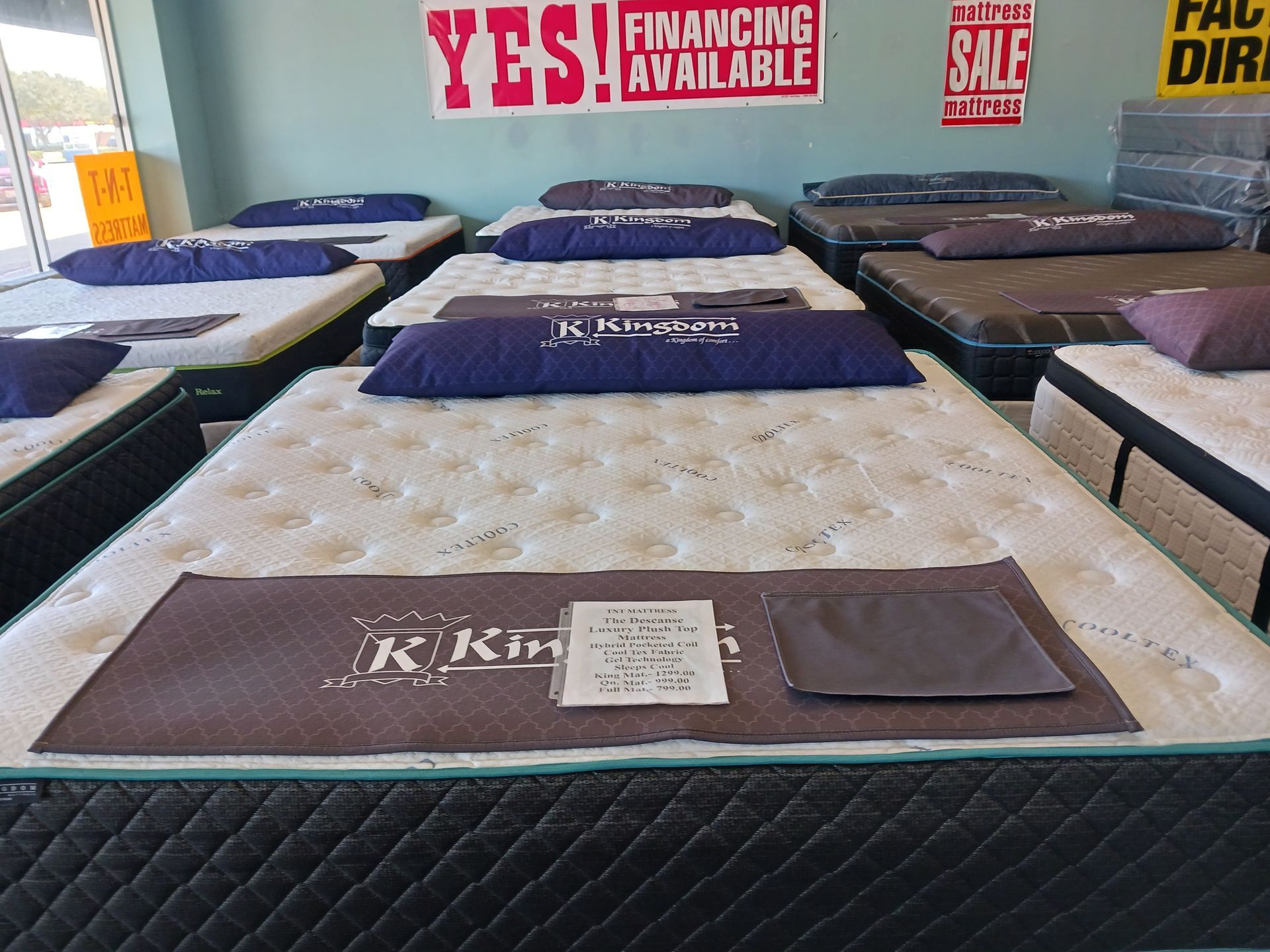 A mattress store with a sign that says yes financing available