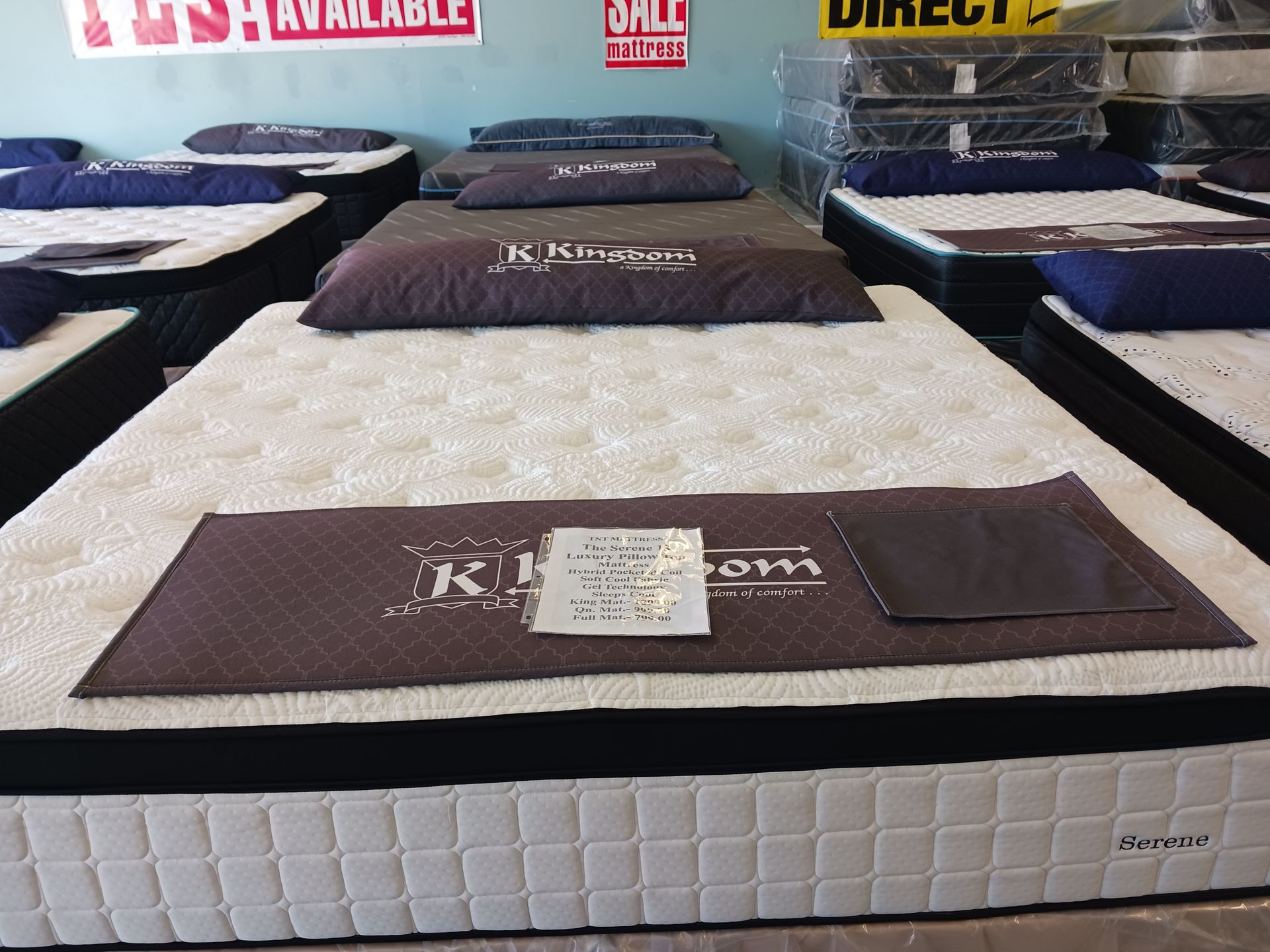 A mattress in a store with a sign that says
