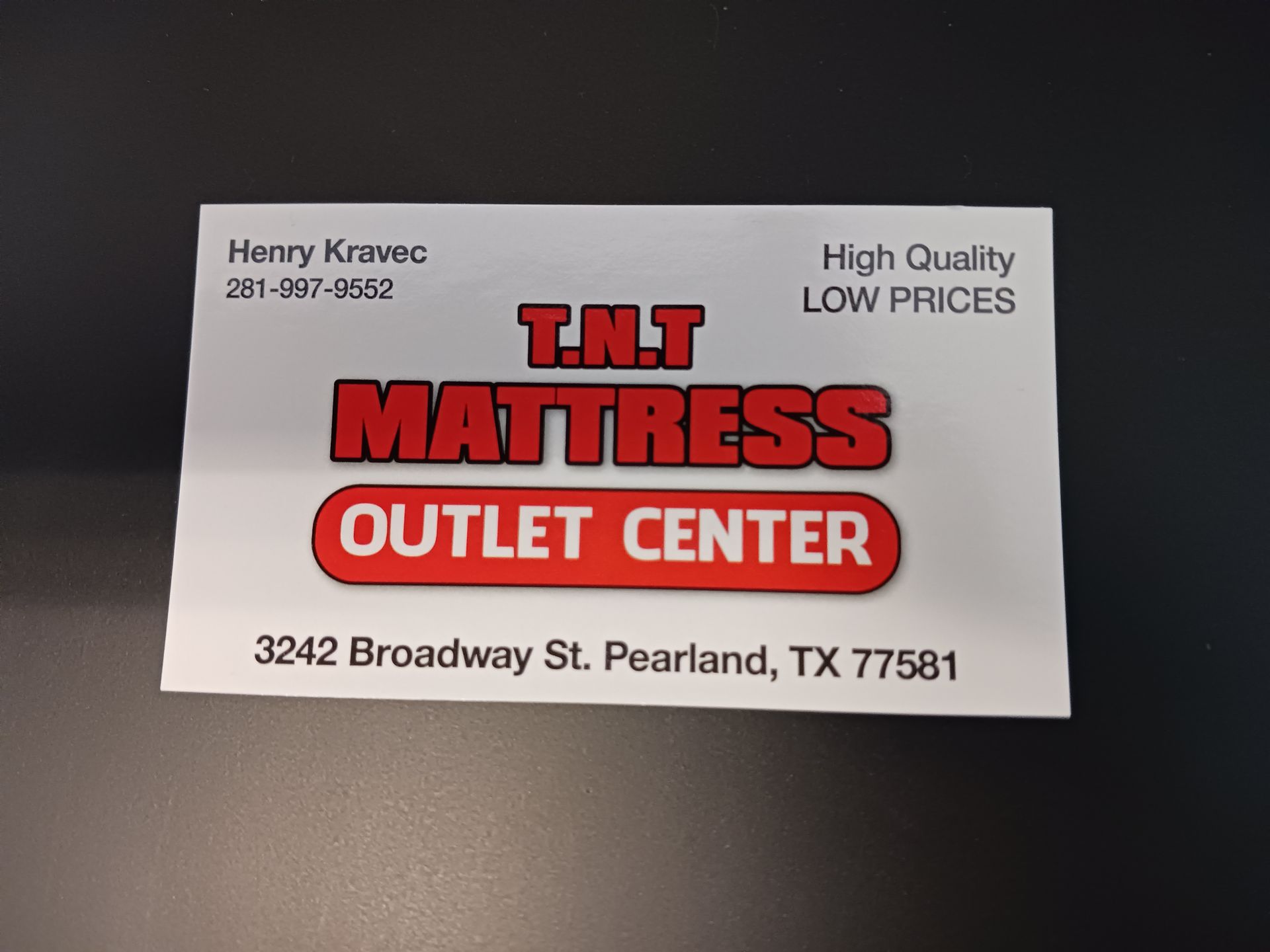 A business card for t.m.t mattress outlet center
