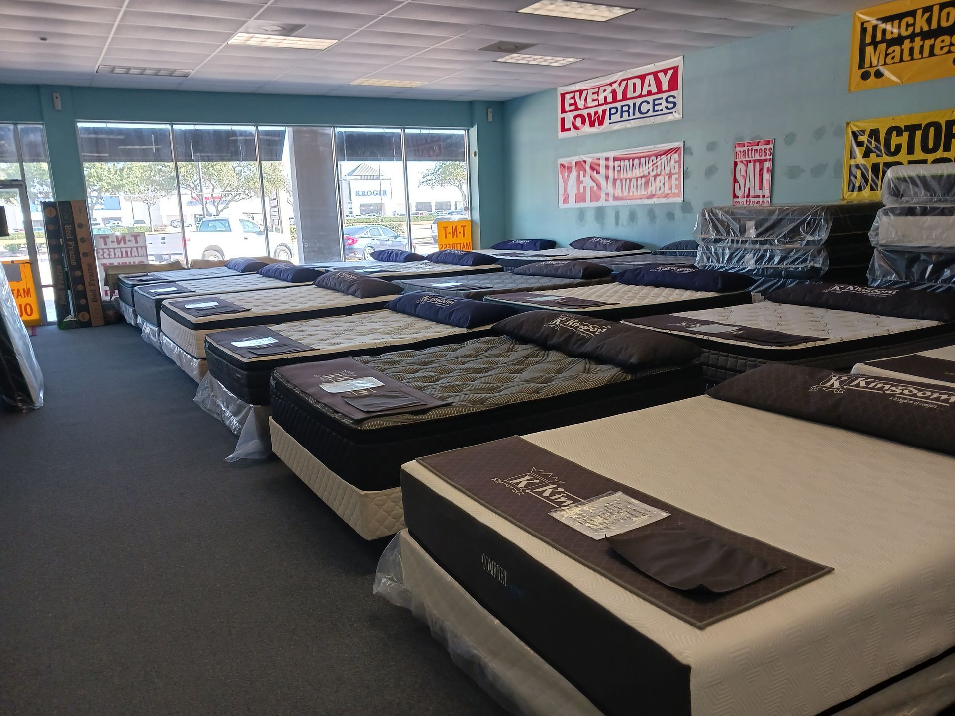 A mattress store with a lot of mattresses on display