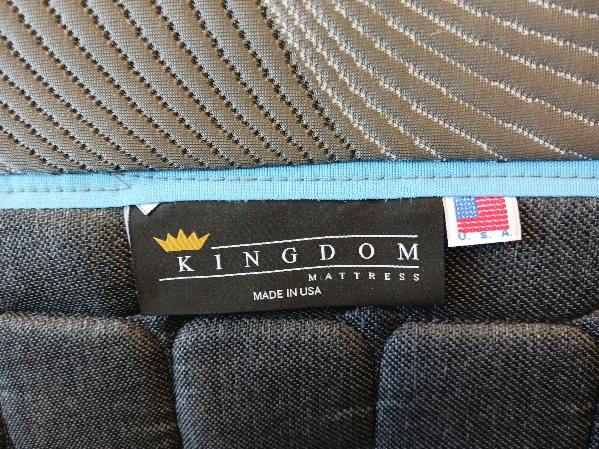 A mattress with a label that says kingdom on it