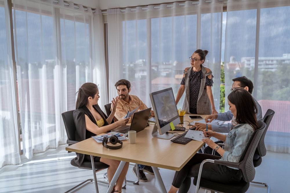 Office Team Meeting at A Large Table — Rescuetech Computer And iPhone Repairs in Alstonville, NSW