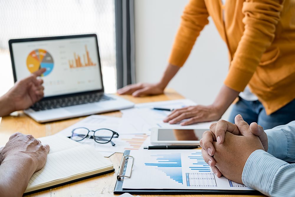 Team Reviewing Business Charts and Data — Rescuetech Computer And iPhone Repairs in Ballina, NSW