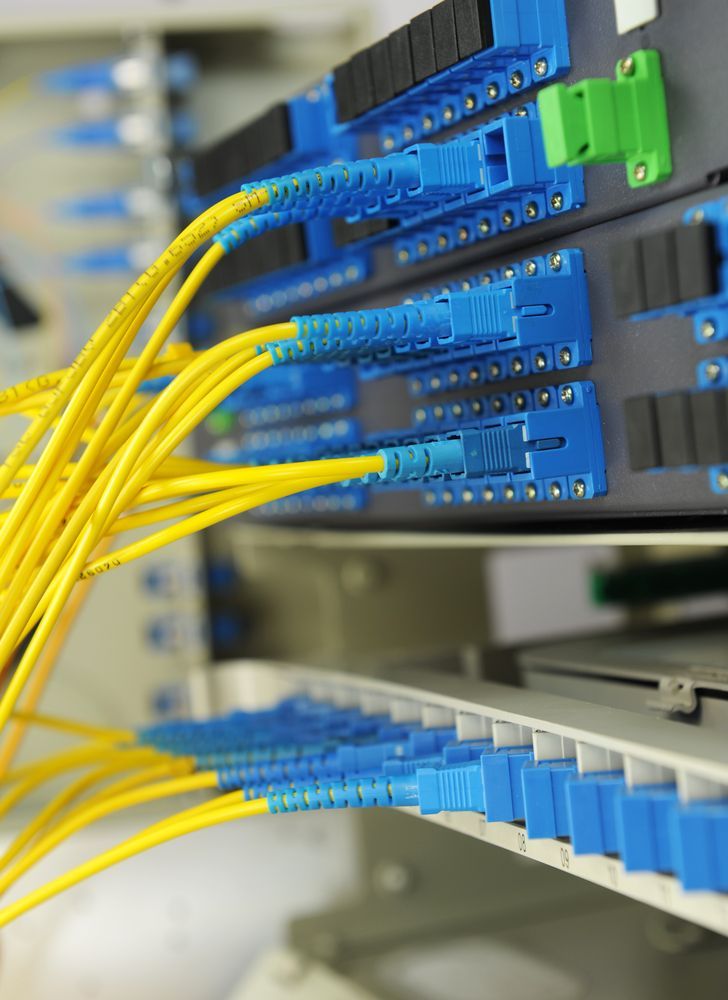 Yellow Fiber Cables on Network Rack — Rescuetech Computer And iPhone Repairs in Lennox Head, NSW