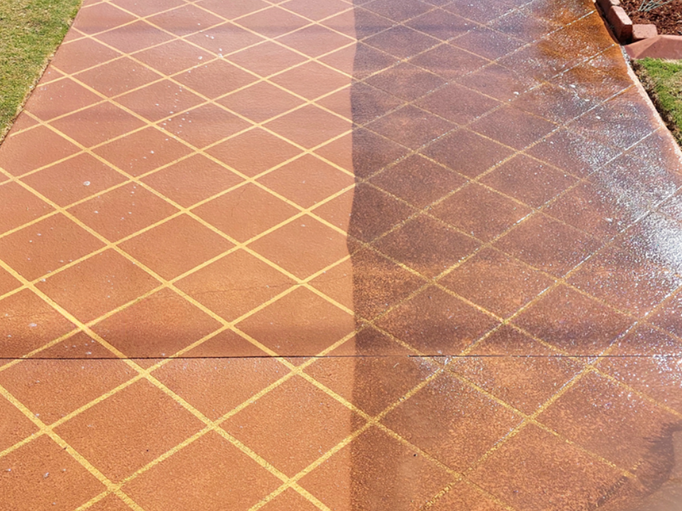 Driveway half cleaned; left side shows clean, diamond pattern, right side shows dirty.