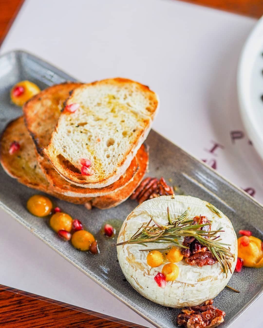 Sourdough Bread, Ricotta Topped With A Sprig Of Rosemary — Cafe, Bar and Catering Services in Southport, QLD