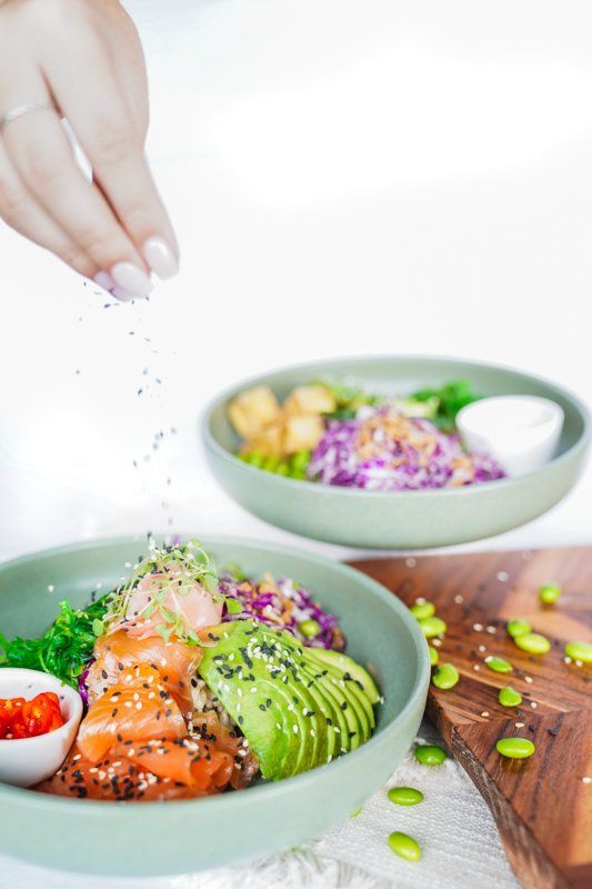 Chef Sprinkling Seasoning Over the Meal — Cafe, Bar and Catering Services in Southport, QLD