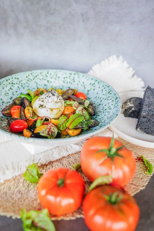 Tomatoes Sitting Beside a Plate of Salad — Cafe, Bar and Catering Services in Southport, QLD