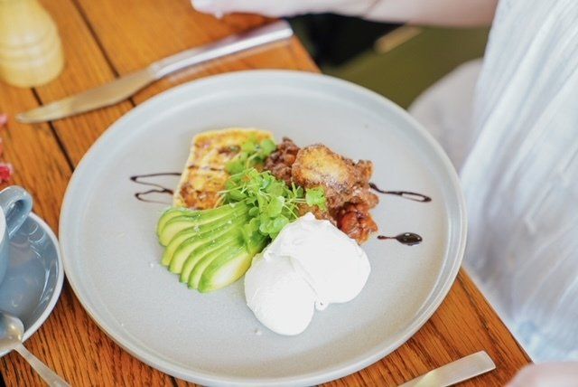 Soft Poached Egg With Sliced Avocado — Cafe, Bar and Catering Services in Southport, QLD