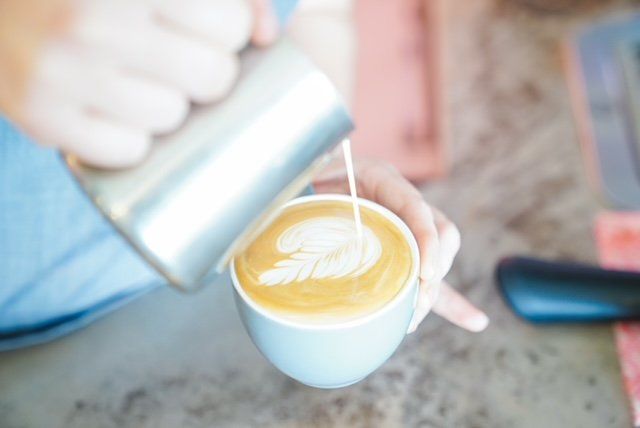 Barista Making Latte Art — Cafe, Bar and Catering Services in Southport, QLD