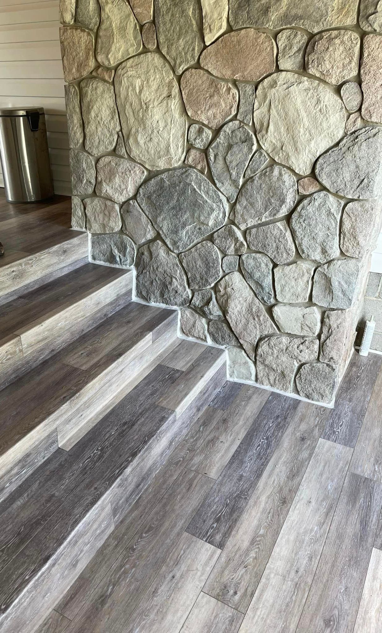 A roof with a skylight and a chimney on it.