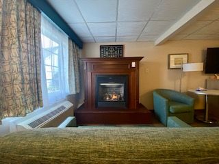 There is a fireplace in the middle of the room.