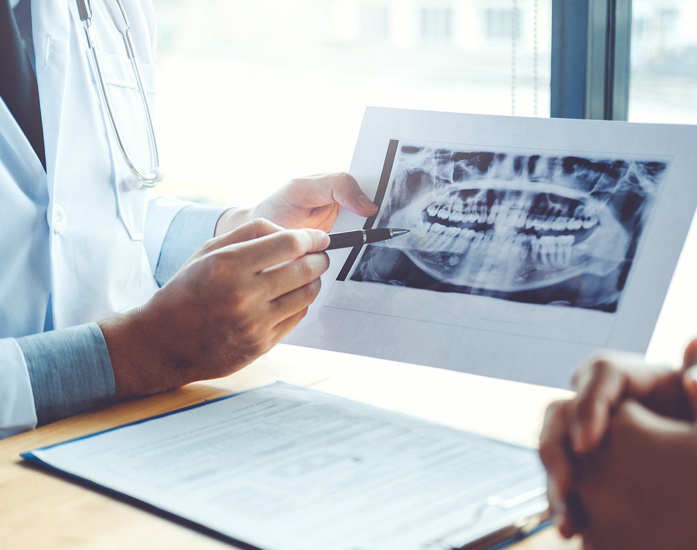 Doctor explaining a dental x-ray