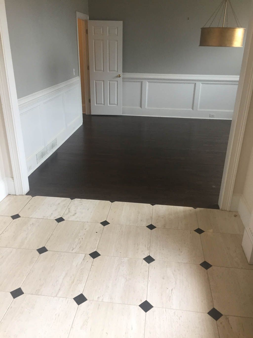 There is a tile floor in the middle of the room.