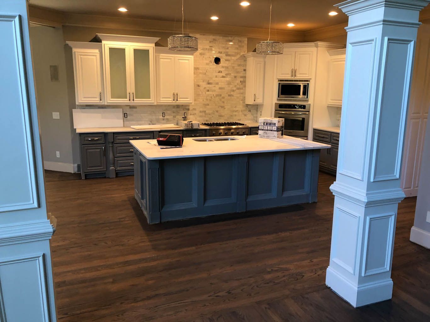 There is a large island in the middle of the kitchen.