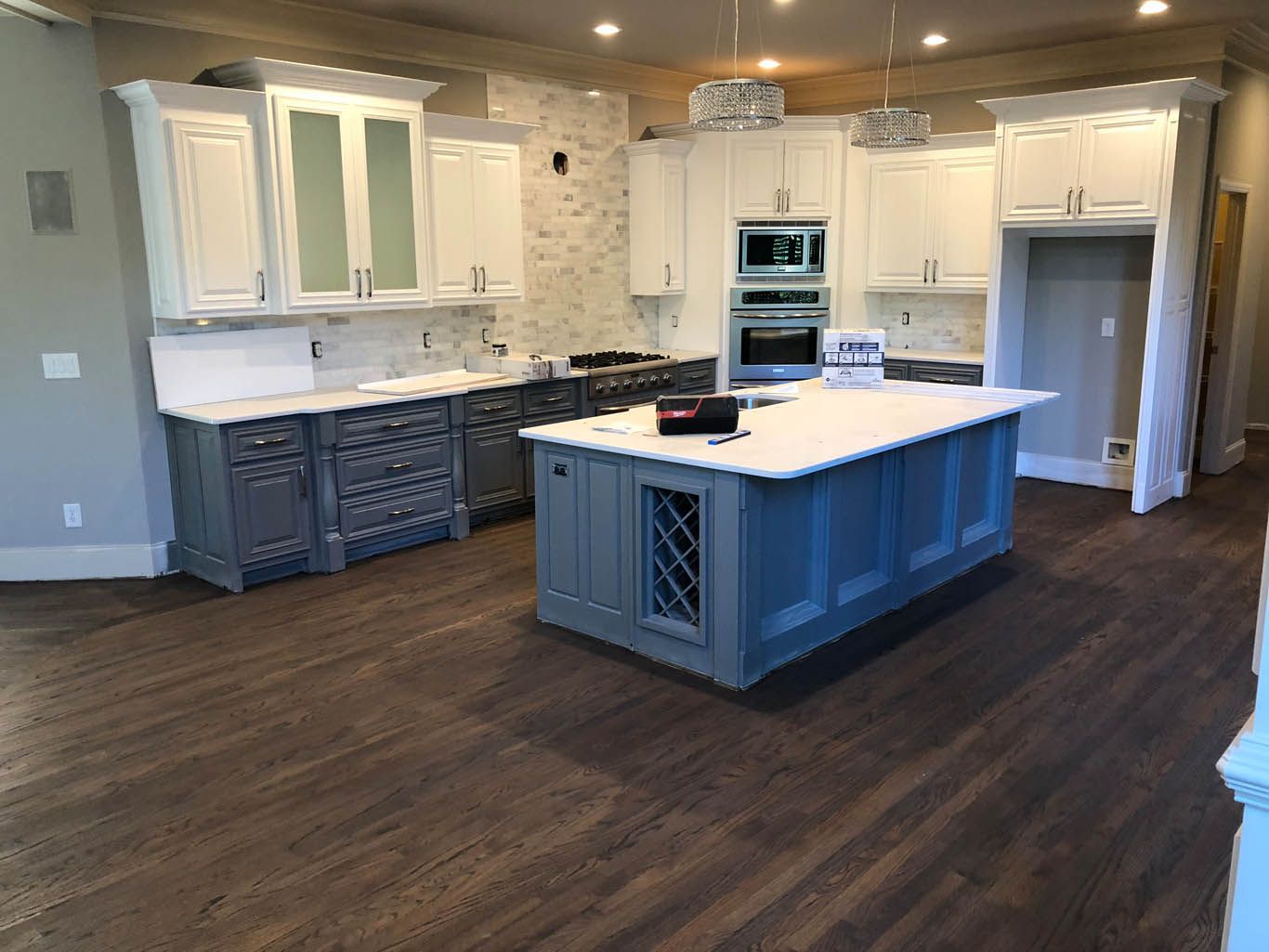A kitchen with a large island in the middle of the room.