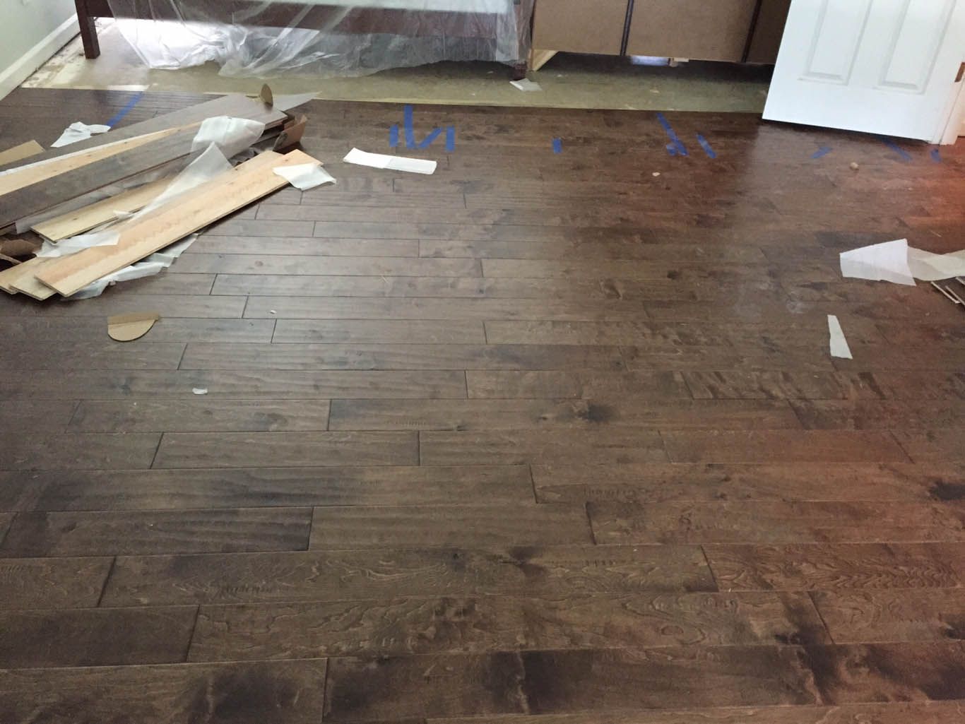 A wooden floor with a lot of pieces of wood on it