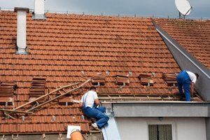 roof tiles being installed