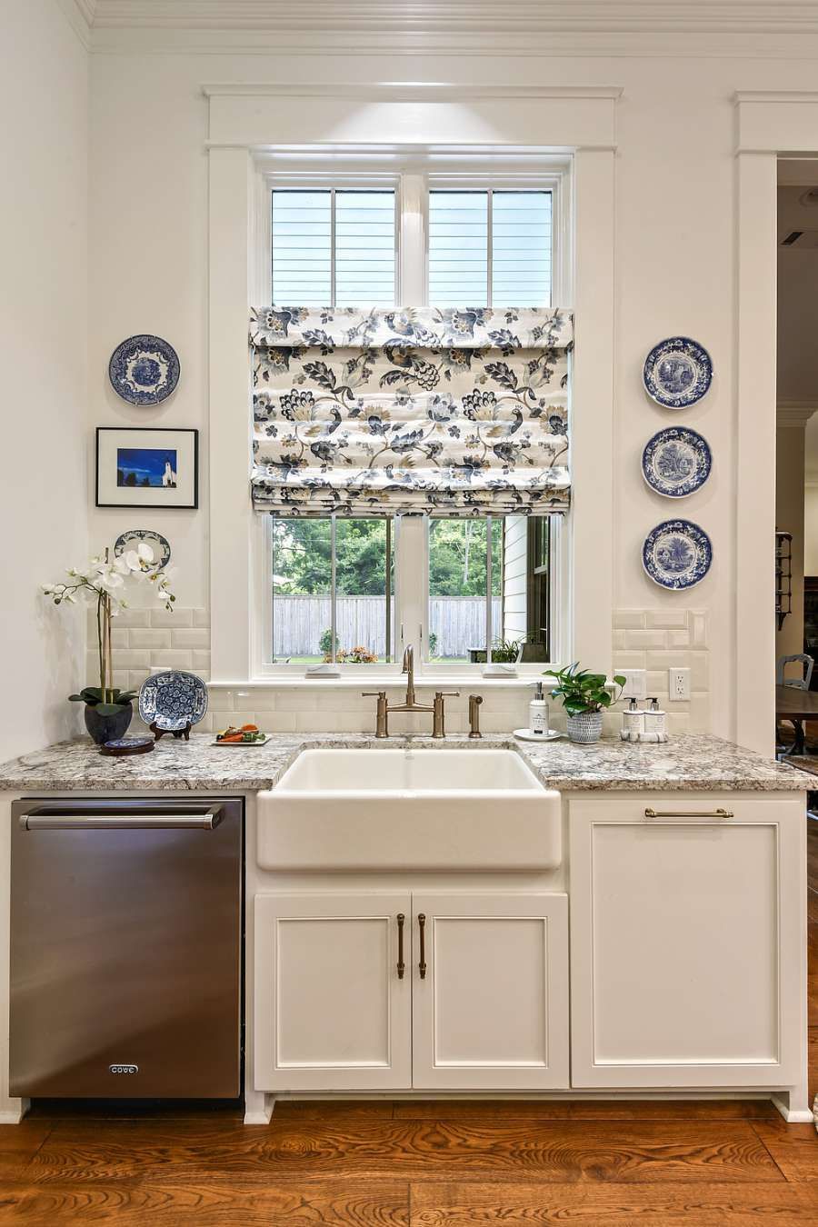 Roman shades over a kitchen sink