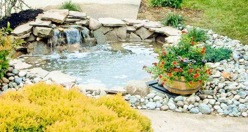 There is a waterfall in the middle of the garden.