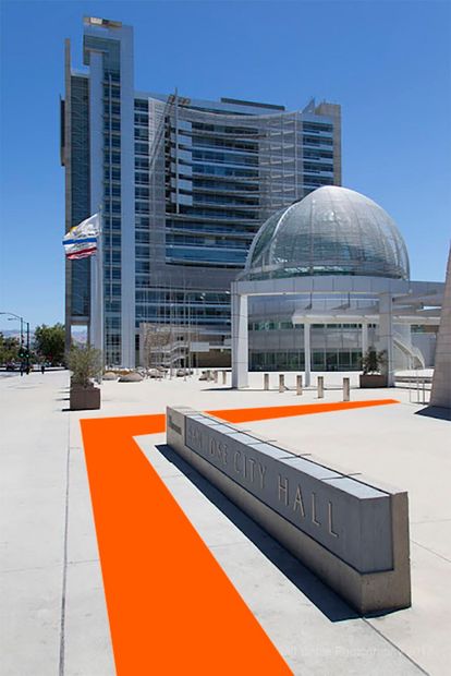 An orange arrow points the way to a building
