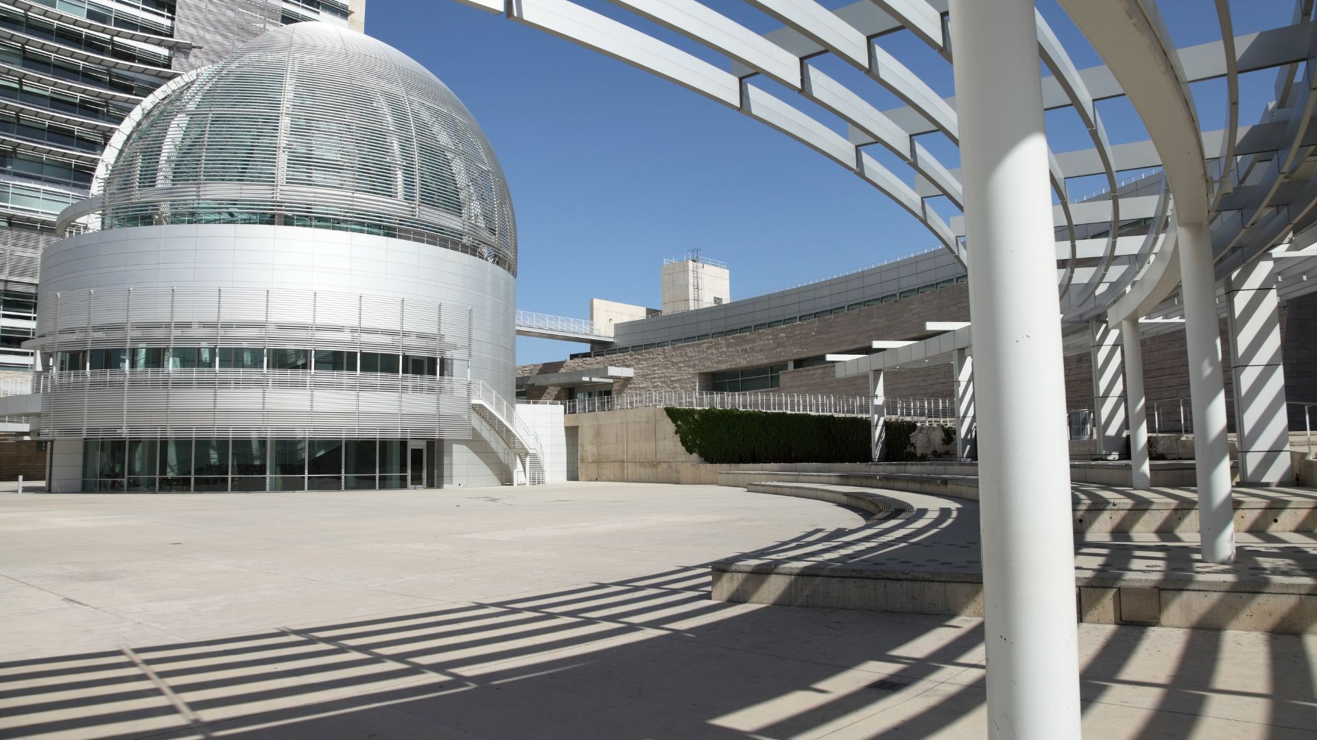 A large building with an orange arrow pointing to it