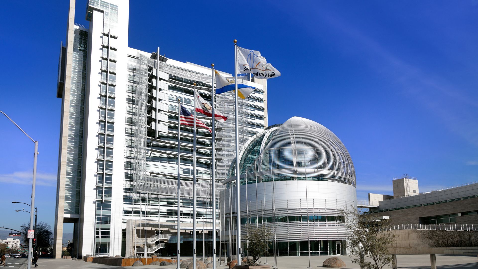 A large building with flags flying in front of it