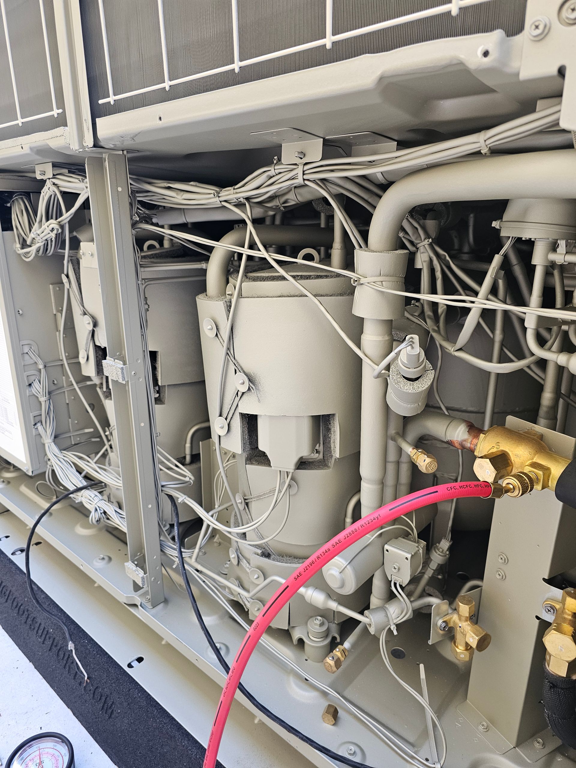 A close up of a machine with a red hose attached to it. — Coastline Air In Forresters Beach, NSW