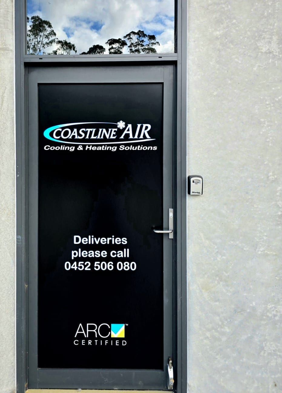 A door with coastline air written on it — Coastline Air In Forresters Beach, NSW