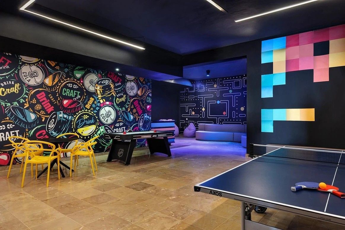 There is a ping pong table in the middle of the room.