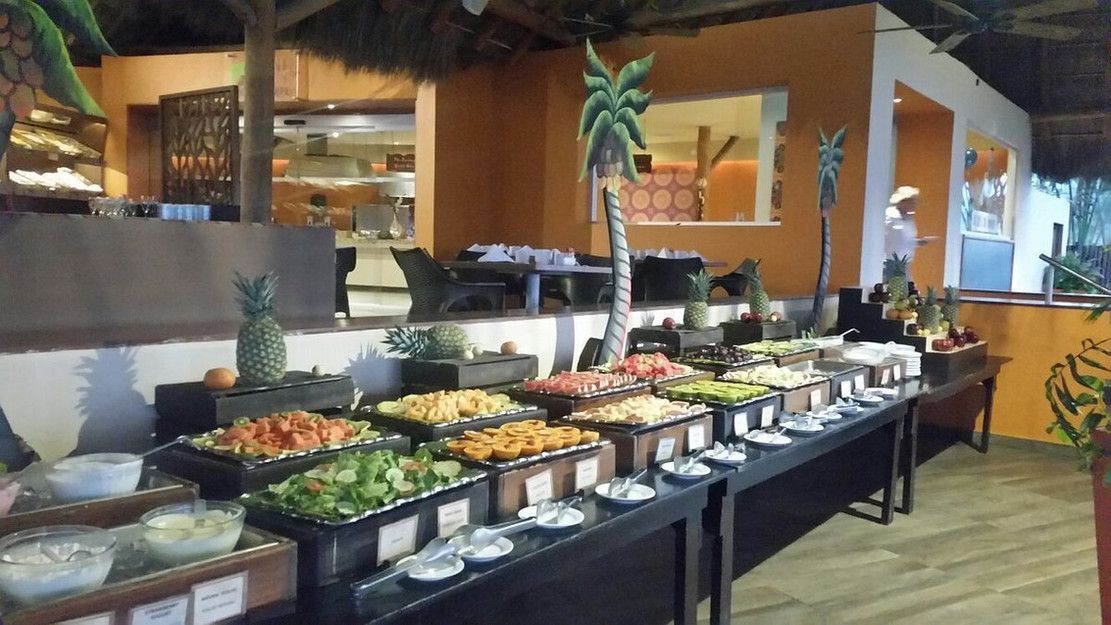 A buffet table with a lot of food on it