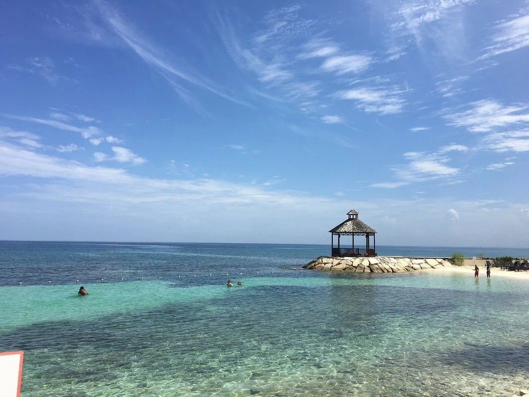 A pier in the ocean with a gazebo