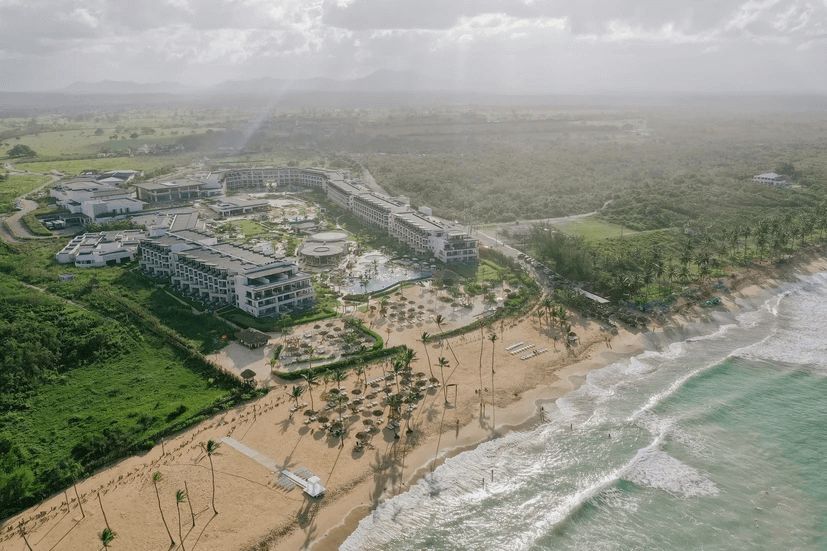 An aerial view of a beach and a resort.