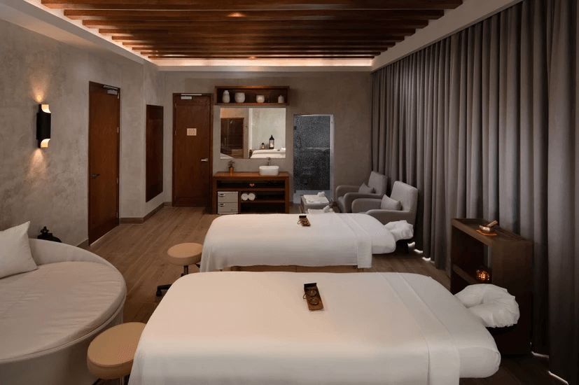 There are two massage beds in the room.