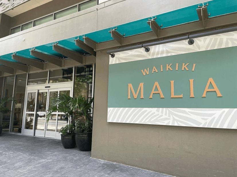 A building with a sign that says waikiki malia