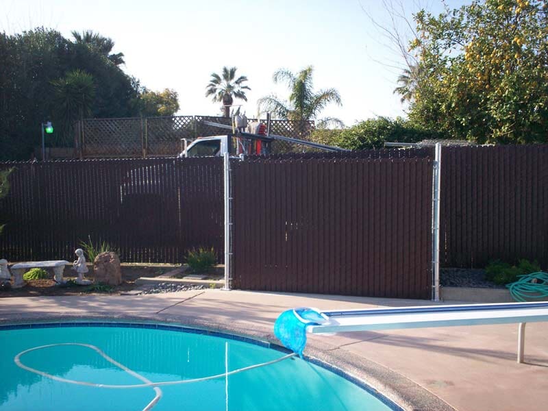 Swimming pool covered with fences — Wood Fences in Bakersfield, CA