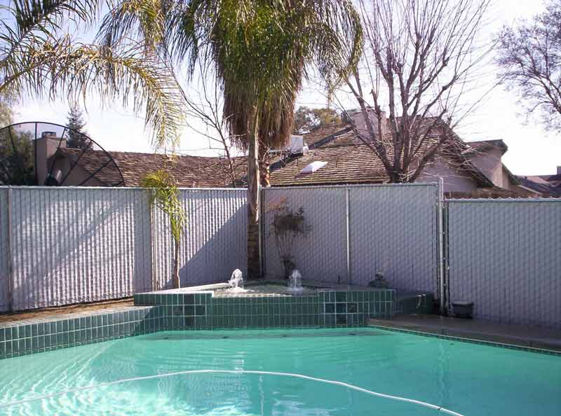 Swimming pool with wood fence — Wood Fences in Bakersfield, CA